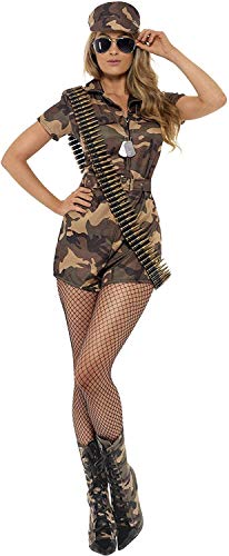 Woman wearing a camouflage jumpsuit, matching cap, fishnet tights, and a bullet belt accessory.
