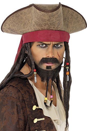 Man dressed as pirate with brown hat, dreadlocks, and brown jacket against a white background.