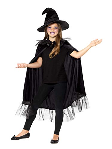 Girl wearing a black witch costume with hat and cape.