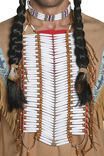 Man wearing a Native American costume with beaded breastplate, fringe shirt, and braided wig.