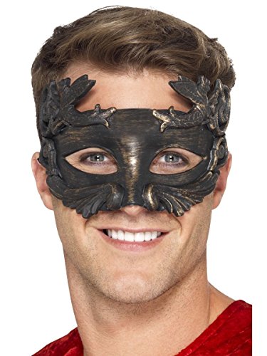 Metallic black masquerade mask with ornate, leaf-like detailing worn by a man.