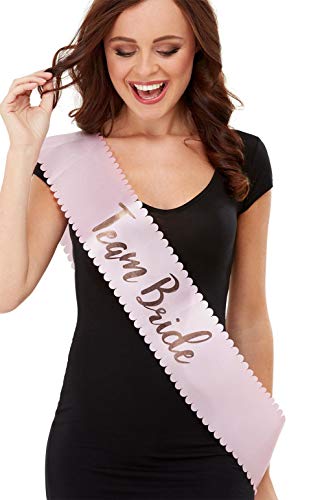 Woman wearing a pink and gold "Team Bride" sash.