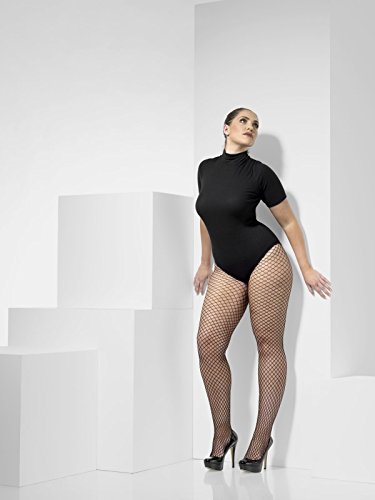 Woman wearing black bodysuit and fishnet tights, posing against a white background with geometric shapes.