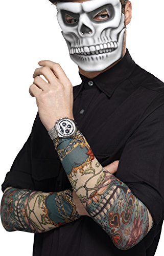 Person wearing a skull mask and tattoo sleeves with Day of the Dead designs.