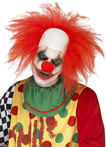 "Man dressed as a clown with red wig, painted face, and colorful costume."
