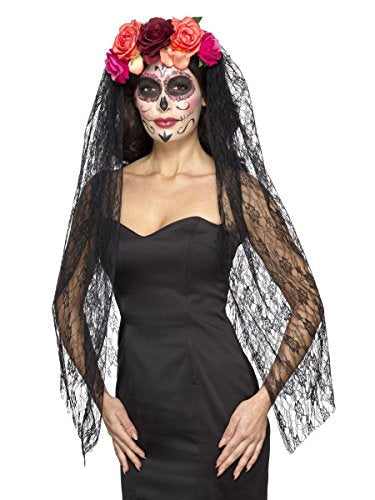 Woman wearing a black lace veil and floral Day of the Dead headband.