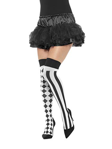 Black and white harlequin patterned hold-up stockings on a leg.