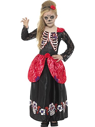 Young girl in a black Day of the Dead costume with red apron and skeleton face paint.