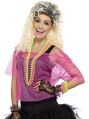 Woman wearing a neon pink fishnet top, black skirt, and colorful beaded jewelry.