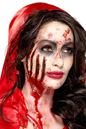 A woman with dark hair and a bloody, claw-marked face and neck.
