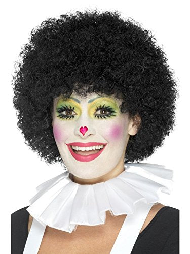 A person dressed as a clown with curly black wig and ruffled white collar.