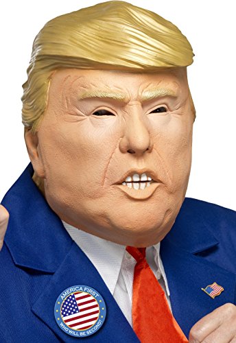 "Donald Trump mask with blue suit, red tie, and American flag pin on lapel."