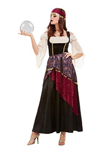 Woman in a black and burgundy fortune teller costume holding a crystal ball.