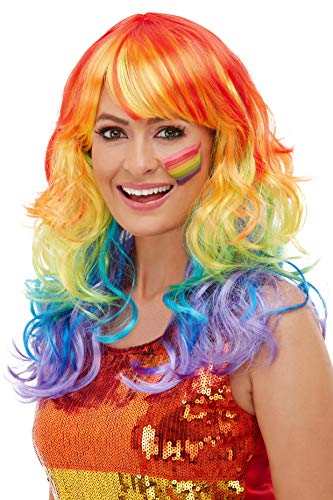 Woman wearing a long, curly rainbow-colored wig and rainbow face paint.