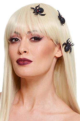 A woman with blonde hair wearing three black spider-shaped hair clips.