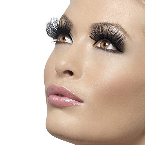 "Blonde woman with long, black false eyelashes and pink lipstick against a white background."
