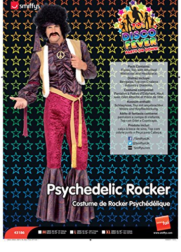 Man in 70s rock star costume with flared trousers and afro wig.