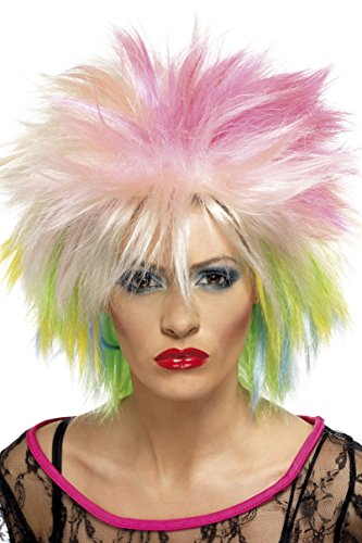 A woman wearing a multi-colored feathered wig and red lipstick, against a white background.