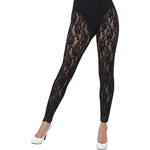 A woman's lower body wearing black lace tights and white high-heeled shoes.