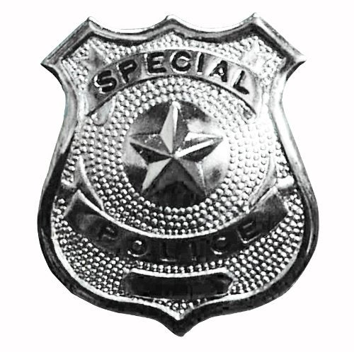 A person wearing a blue suit with a silver police badge on their lapel.