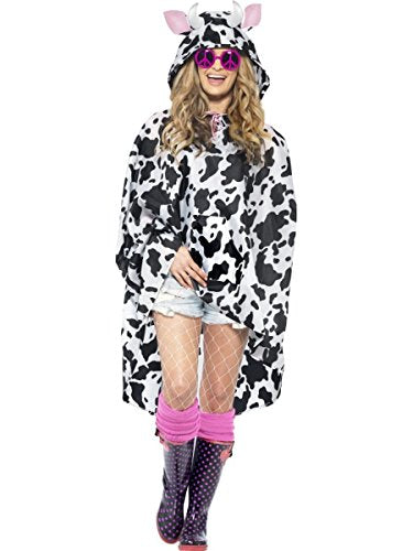 Person wearing a black and white cow-print poncho with a hood.
