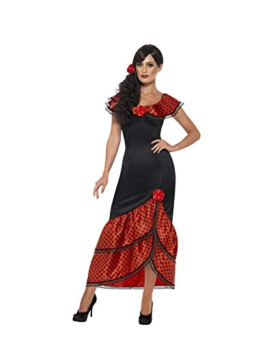 Woman in a black and red polka dot flamenco dress and headpiece.