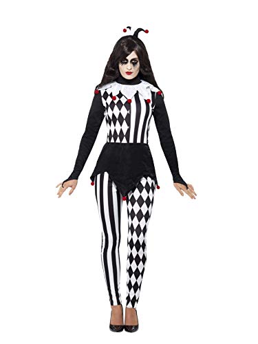 Woman in black and white harlequin jester costume, full body view.