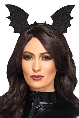 Black glitter bat wings on a headband worn by a person.