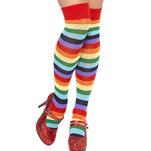A pair of legs wearing multi-coloured striped socks and red sparkly shoes.