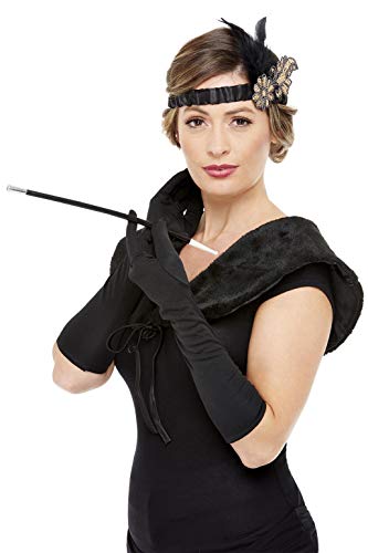 Woman modeling 1920s flapper accessories: headband, gloves, boa, and cigarette holder.