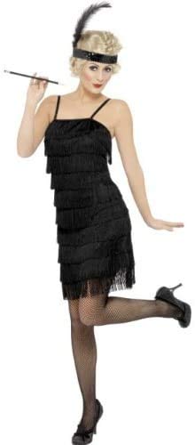 Woman wearing a black, fringed 1920s flapper dress and headband.