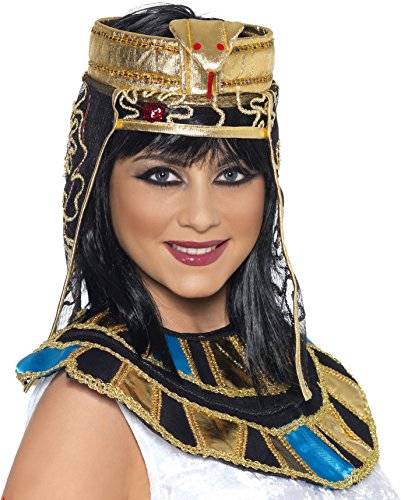 A woman wearing a gold, black, and blue Egyptian-style headdress and matching collar.