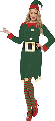 Woman wearing a green elf costume with red accents, striped tights, and red shoes.