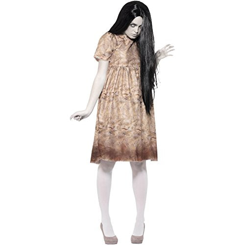 A woman in a stained beige dress, pale skin, and long black hair.