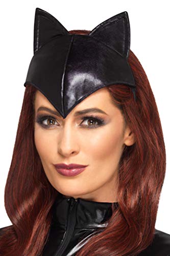 Black cat ear headband worn by a person with red hair.