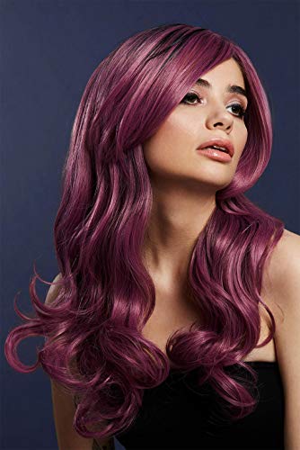 Woman with long, curly, dark magenta wig against a dark blue background.