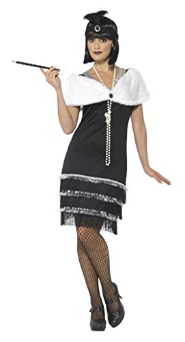 Woman in a black 1920s flapper dress with feather headband and pearls.
