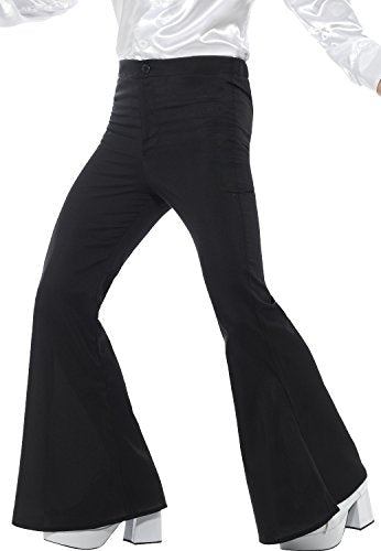 Black, high-waisted flared trousers worn with white platform shoes.
