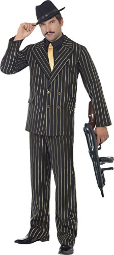 Man dressed as a gangster, wearing a black pinstripe suit, hat, and holding a gun.