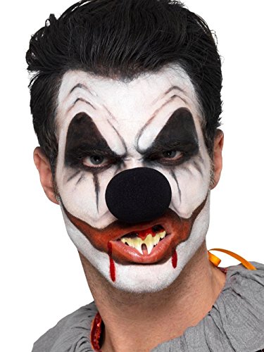 Killer clown makeup kit with fake blood, sponge, and eyeshadow palette.