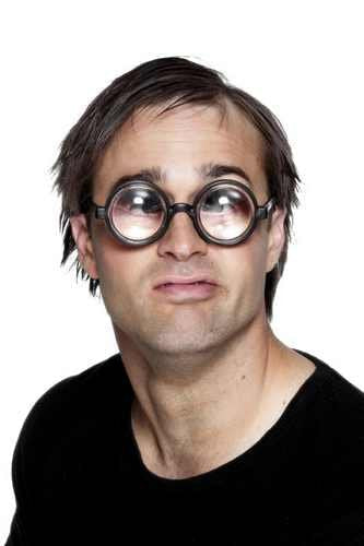Man wearing oversized, round, bug-eye novelty glasses.