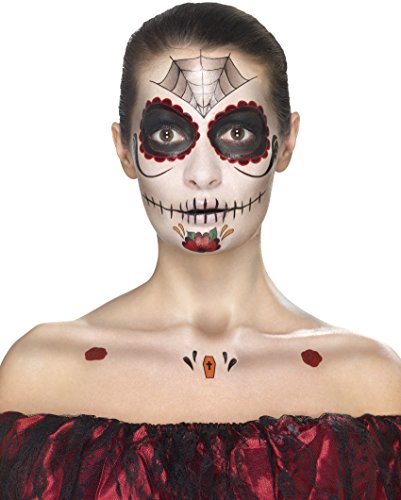 A woman with a sugar skull face paint design and red flower crown.