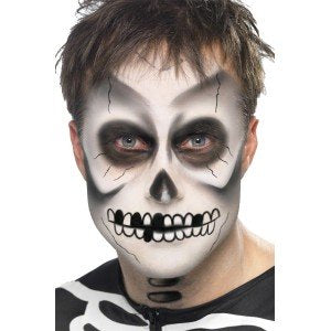 Smiffys skeleton makeup kit packaging with face paint, sponge, crayon, and application instructions.