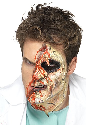 Man with gruesome zombie makeup applied to half of his face.