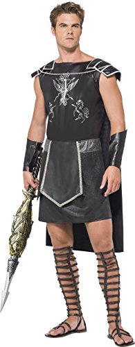 Man wearing a black gladiator costume with sword and leg wraps.