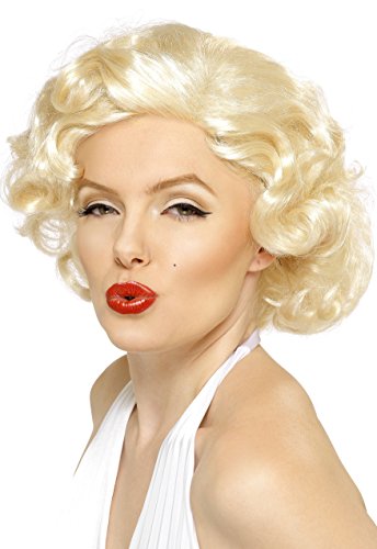A woman wearing a blonde curly wig, red lipstick, and a white halter top.