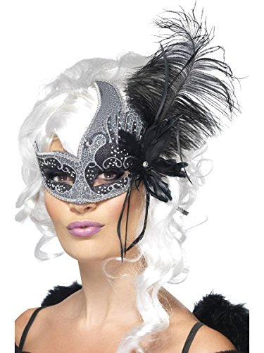 Silver and black feathered masquerade eye mask on a model with white hair.
