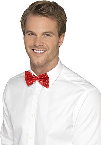 Man wearing a white shirt and a red sequin bow tie, smiling.