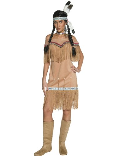 Woman in a tan, fringed dress with a feathered headband and boots.