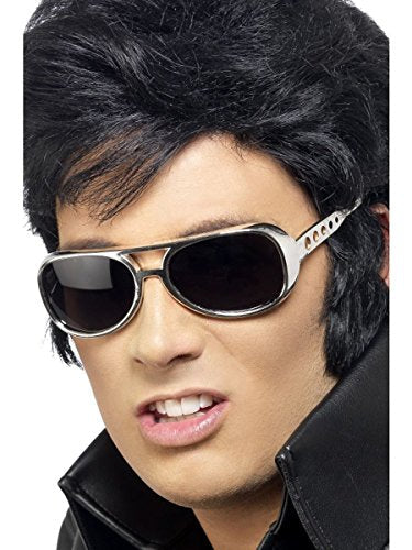 Close-up of a person wearing silver, rhinestone-studded Elvis-style sunglasses.